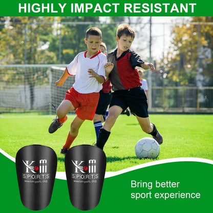 Children playing soccer on a field with KM Sports shin guards displayed.